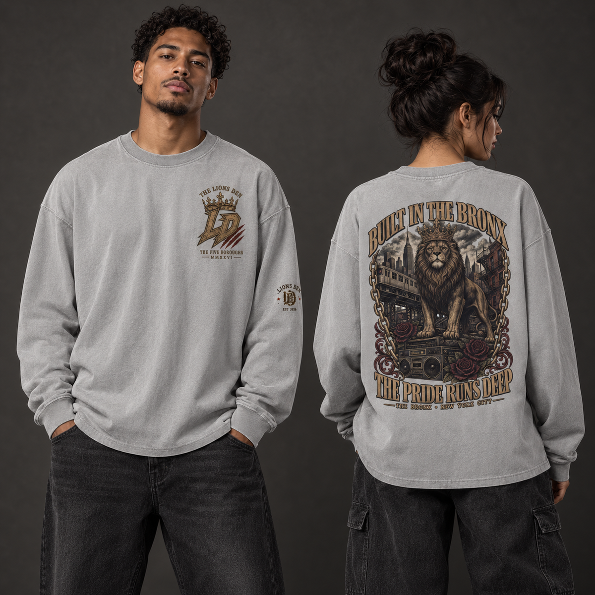 Two models wearing the light gray Lions Den Built in the Bronx vintage-wash long-sleeve tee, shown from the front and back