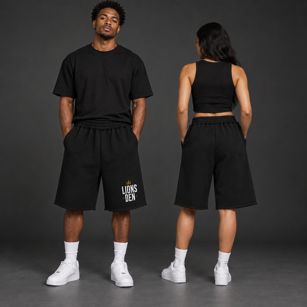Two models wearing the black Lions Den crowned stacked-logo raw-edge fleece shorts, shown from the front and back