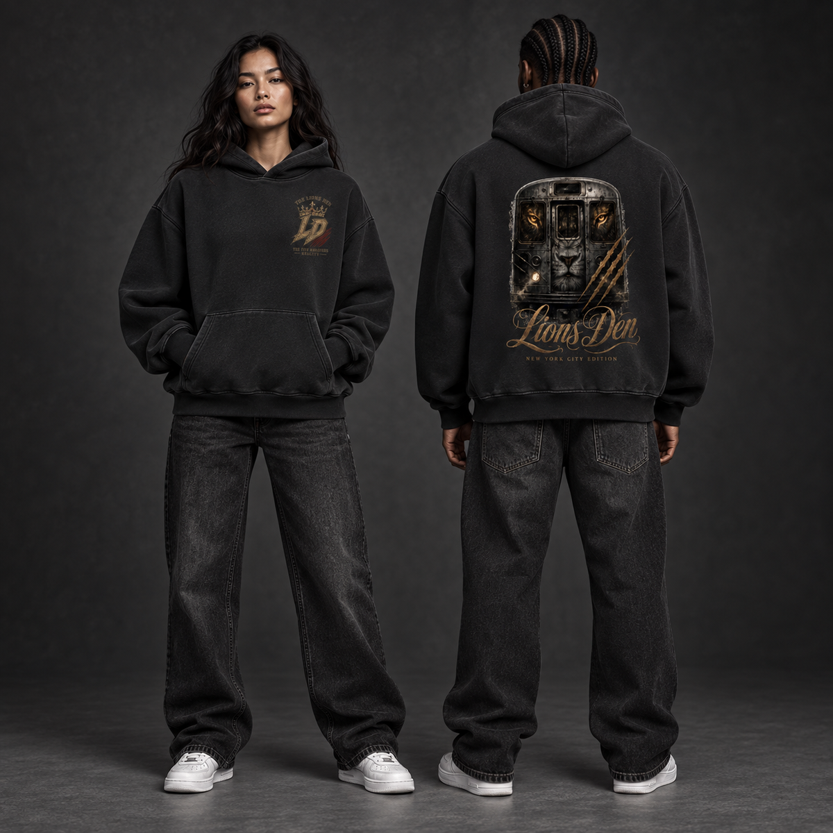 Two models wearing the black Lions Den Lion Gate vintage-wash boxy fleece hoodie, shown from the front and back