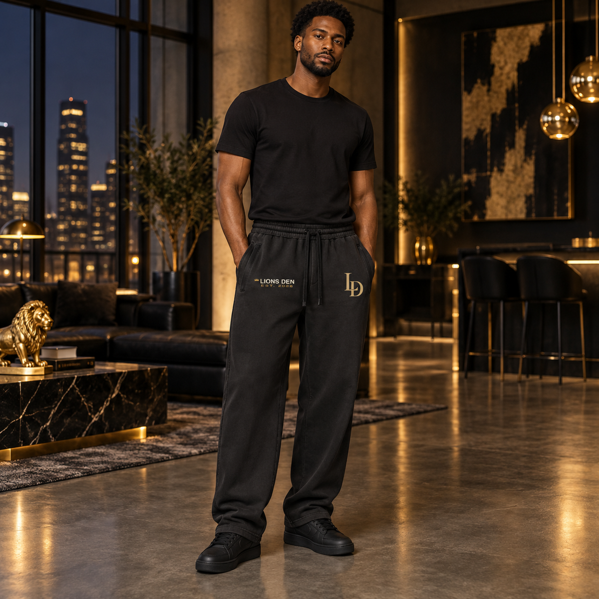 Dual-mark LD and Lions Den vintage-wash sweatpants on model