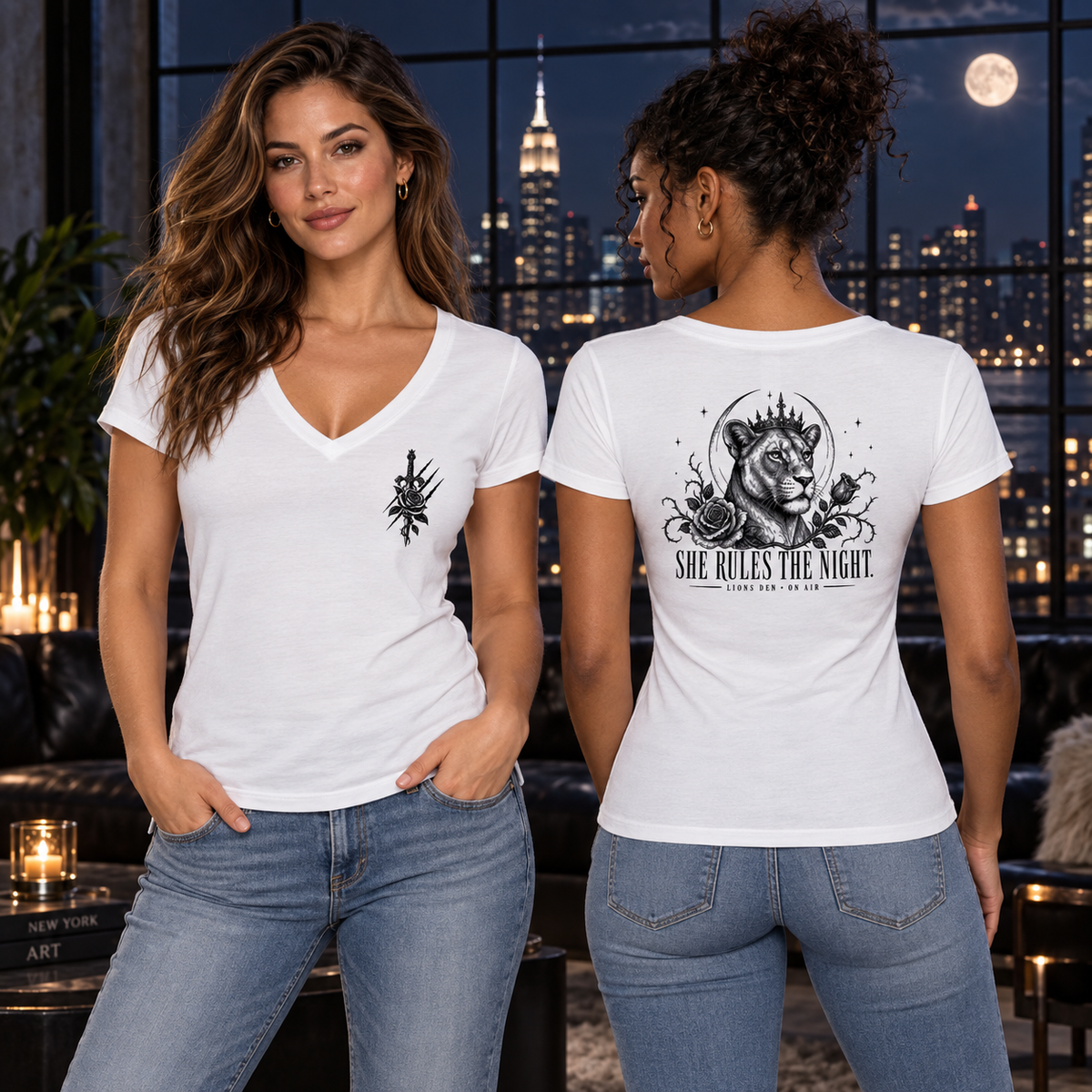 Two women model the white Lions Den She Rules the Night V-neck tee, showing the dagger-and-rose chest mark and crowned lioness back artwork.