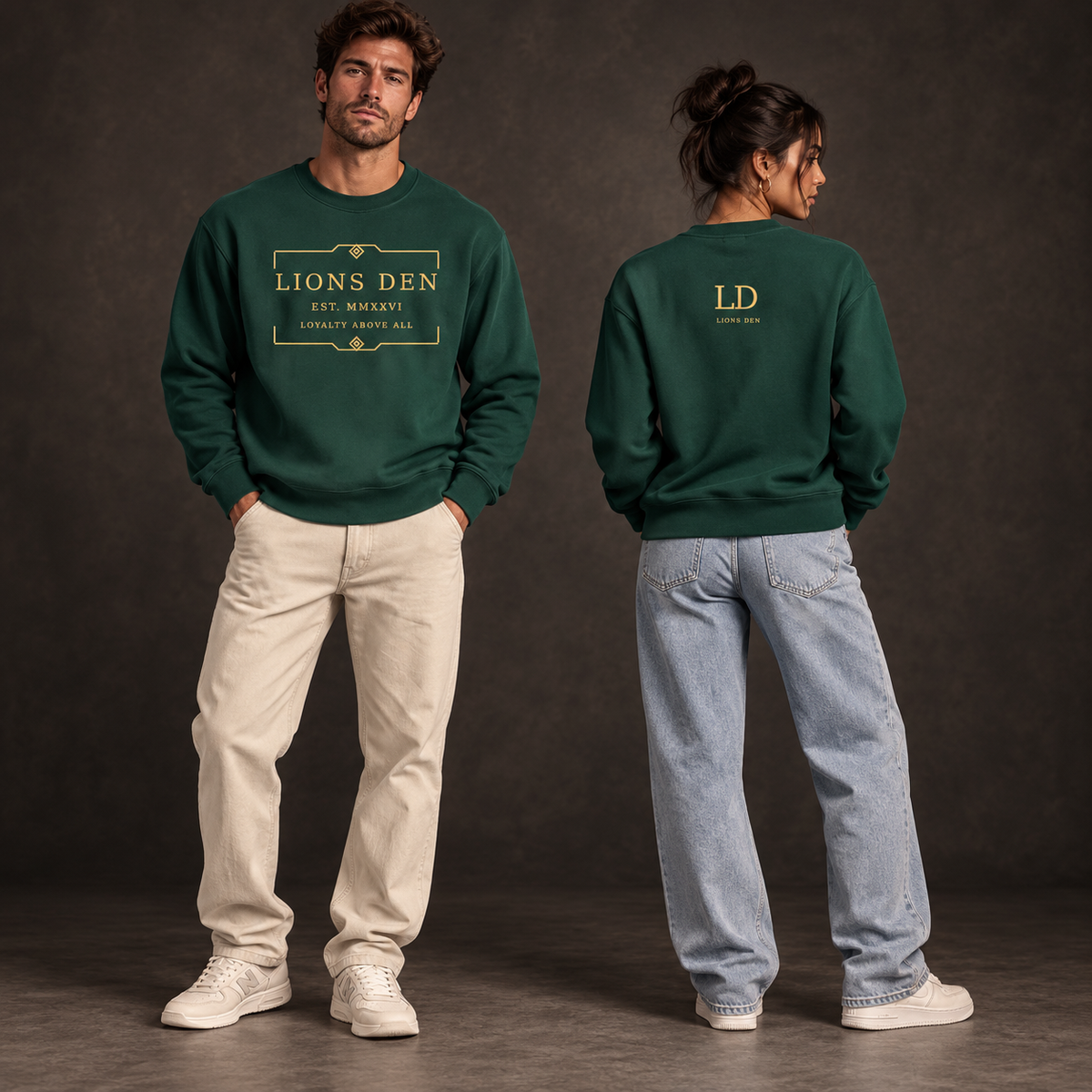 Two models wearing the forest-green Lions Den Loyalty Frame heavyweight cotton sweatshirt, shown from the front and back