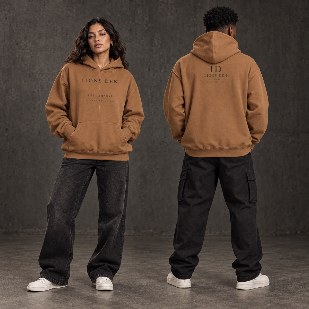 Two models wearing the mocha Lions Den Loyalty Line oversized essential hoodie, shown from the front and back