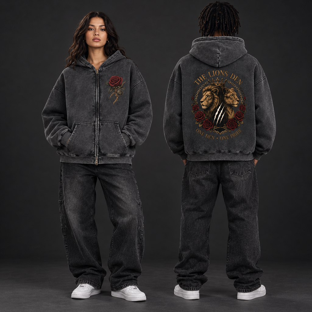 Two models wearing the washed-black Lions Den One Den One Pride zip hoodie, shown from the front and back