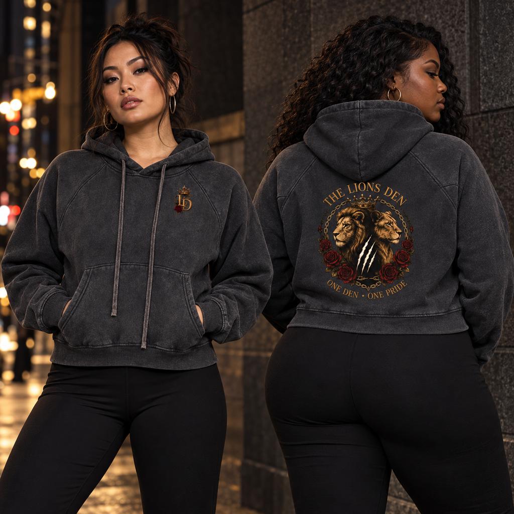 Two women modeling the Lions Den One Den One Pride snow-washed cropped hoodie, showing front and back