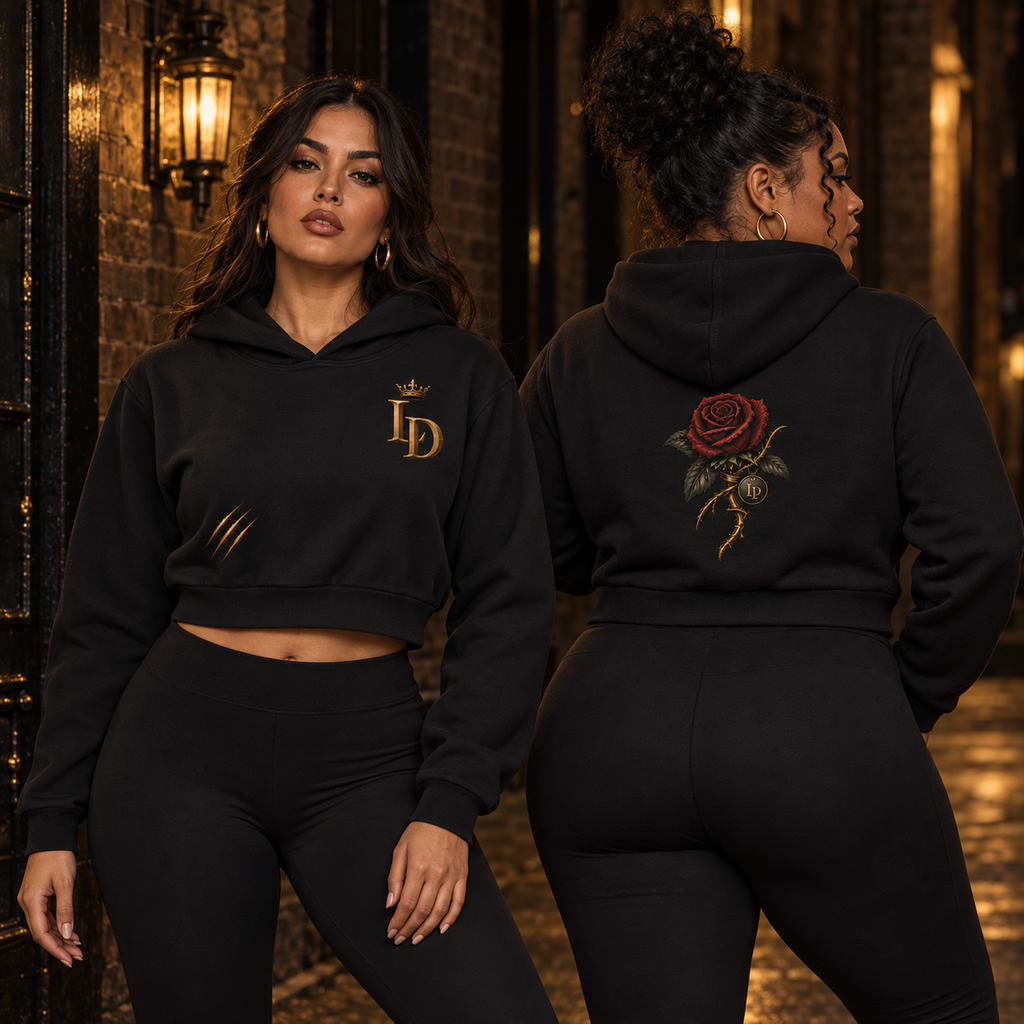 Two women modeling the Lions Den Rose and Claw essential cropped hoodie, showing front and back