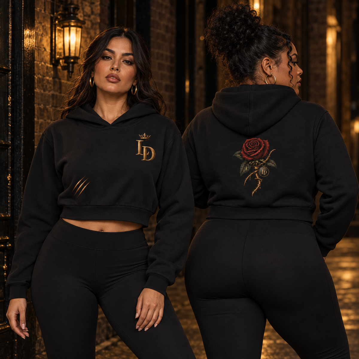 Two women modeling the Lions Den Rose and Claw essential cropped hoodie, showing front and back