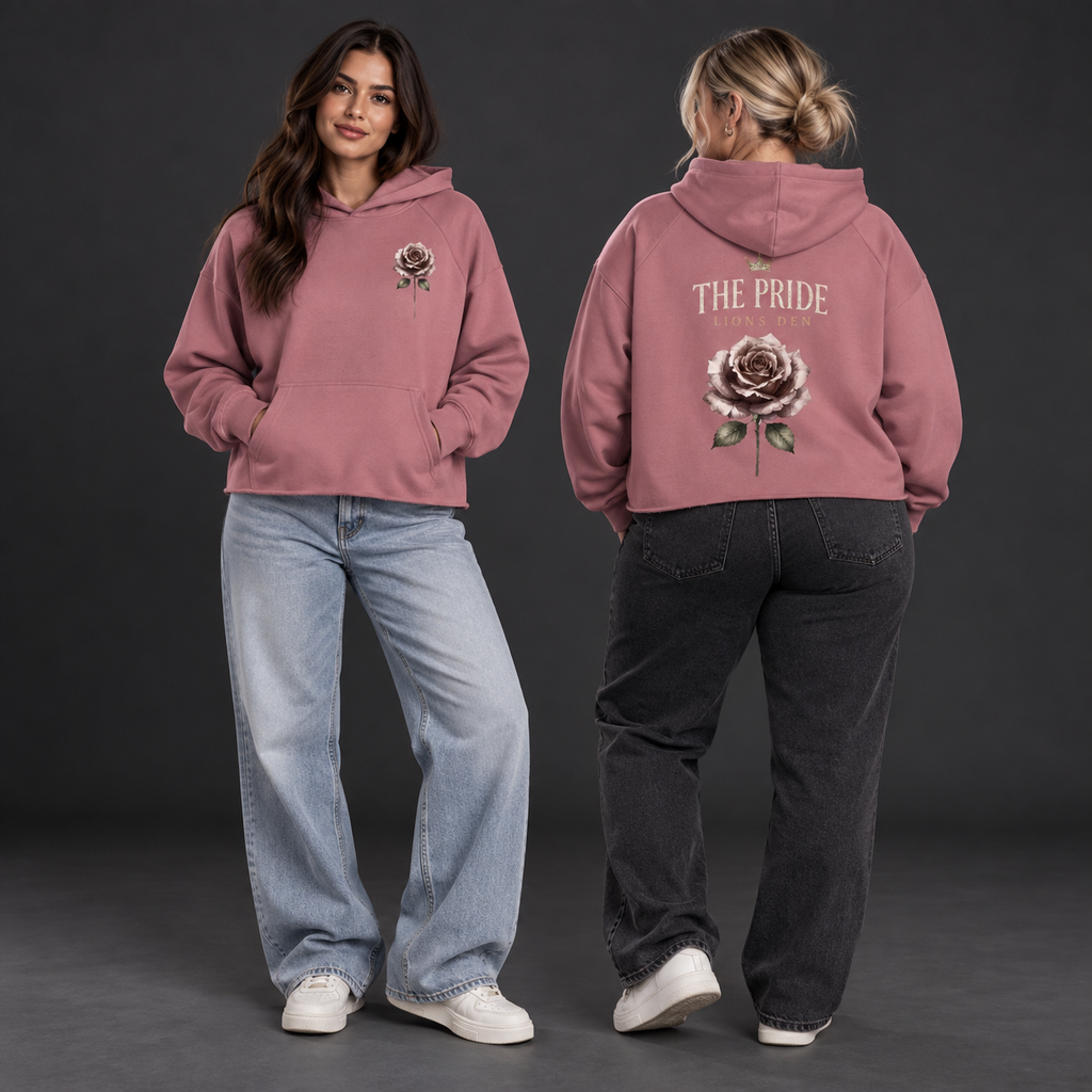 Two women wearing the dusty rose Lions Den The Pride Rose vintage-wash raw-edge hoodie, shown from the front and back